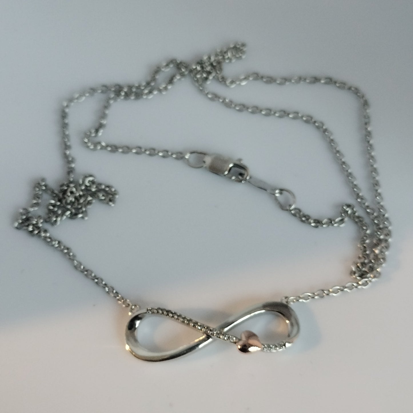 Sterling silver Diamond Infinity Pendant with 10k Rose Gold Heart and Silver Chain